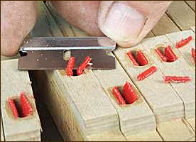 Final trimming of cloth tabs on flush cut bushings